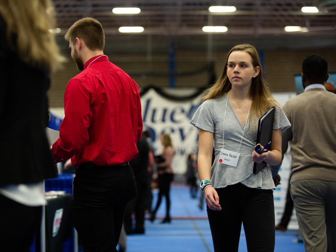 Students walk through the 2020 Spring Career Conference, held before the COVID-19 pandemic.