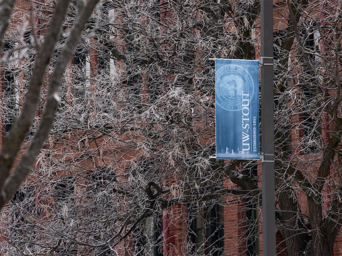 Frosty trees and banners on campus.