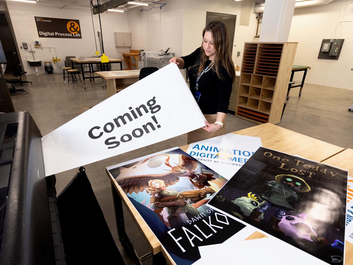 Kerstin Nye, a Master of Fine Arts in design student, uses the new wide-format inkjet printer in the new lab.