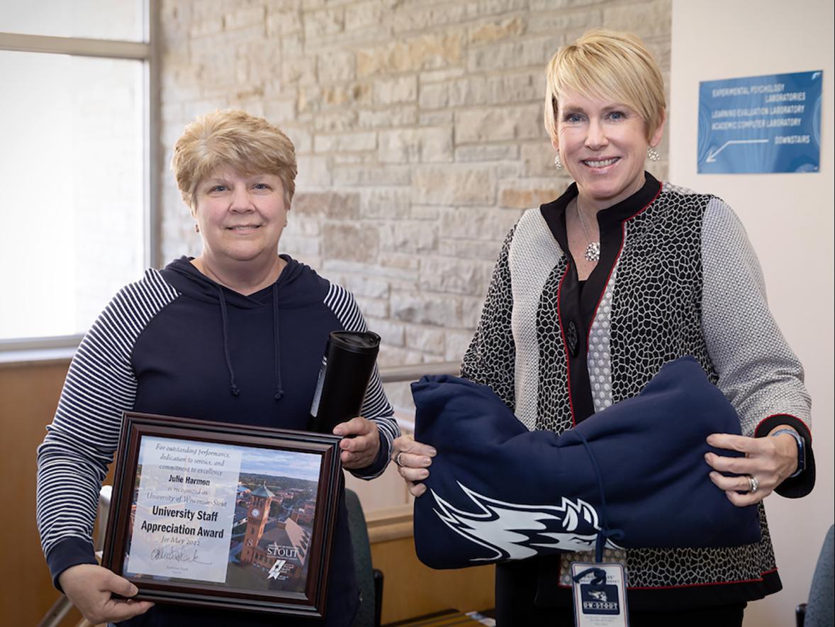 Julie Harmon, left, receives the May University Staff Appreciation Award from Chancellor Katherine Frank.