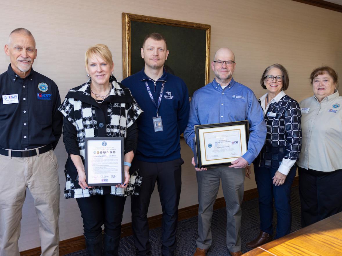 Mike Hallquist, Chancellor Katherine Frank, Tech. Sgt. Jeremy Nelson, Deputy CIO Tom Janicki, CIO Sue Traxler and Martha Stratton