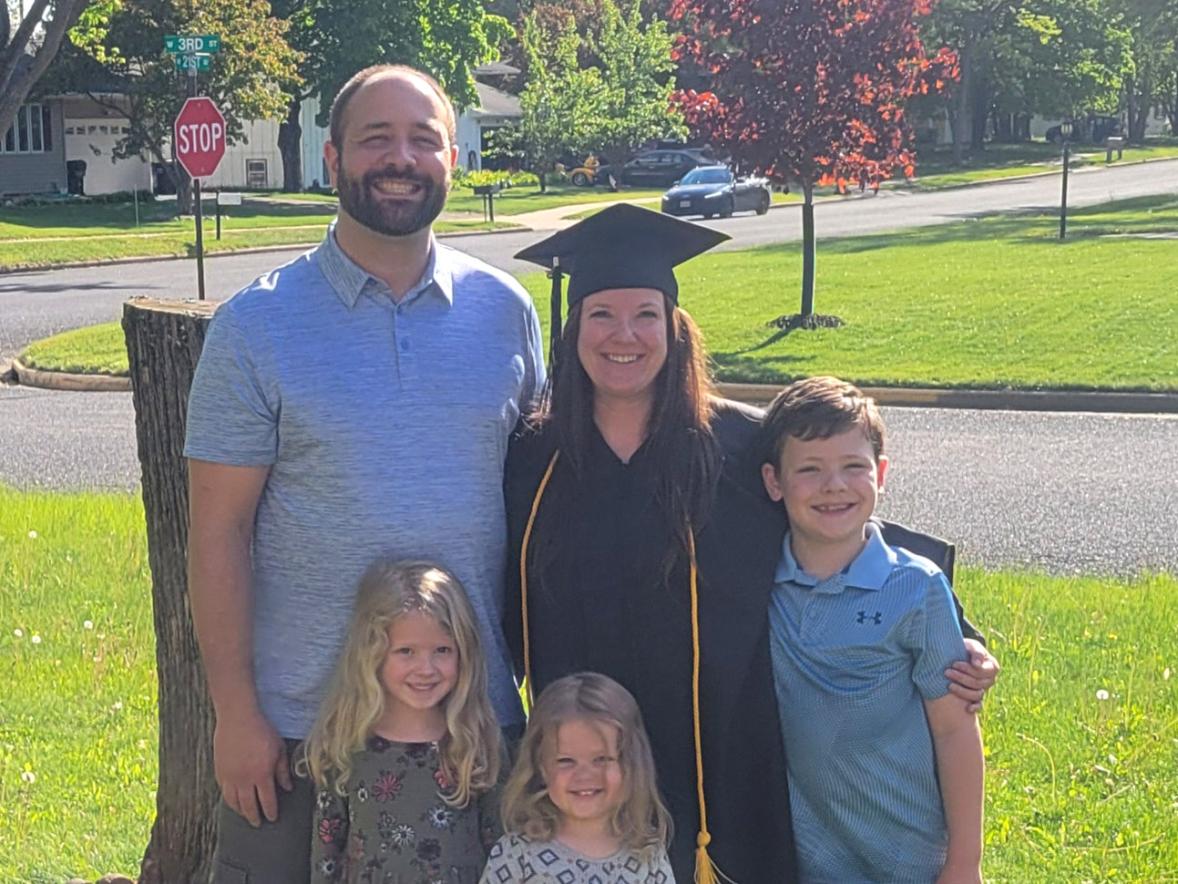 Family standing with graduate
