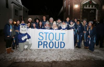 The WinterDaze parade is photographed on Thursday, December 8, 2016 on Main Street. Students and staff participated in the parade to represent the University, including the UW-Stout Cheer Team. (UW-Stout Photo by Noah Van Wyk)