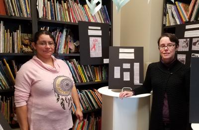 PCEM student Rosie Muckley and Professor Kate Edenborg in the Michael M. Levy Children's Literature Library, Harvey Hall.