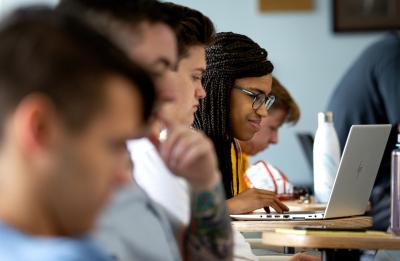 A group of students attend a session