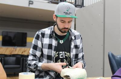 Alexander Mayhew, industrial design graduate, working on sneaker prototype.