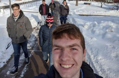 Nathan Thompson, first-year double-major in applied science and mechanical engineering, walking campus with friends.