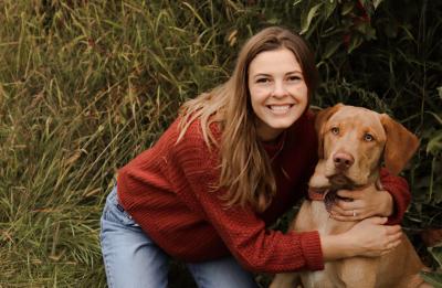 GDIM senior Eliana Fergus with her dog.