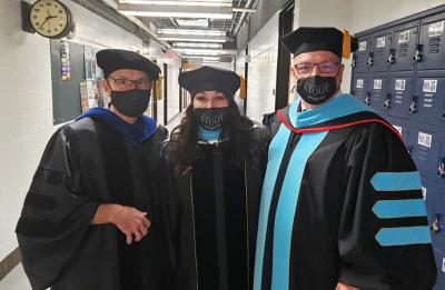 CTEL Program Director Urs Haltinner and doctoral graduates Rachel Krueger and Brian Stout at commencement.