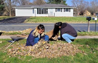 Students helping with community fall clean up.