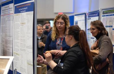 Students presenting their posters on Research Day.