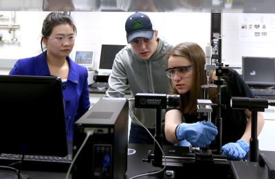 Associate Professor Min DeGruson with students in the Packaging Materials course.