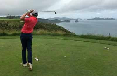 Klobucar tees off on the seventh hole at Kauri Cliffs, a resort golf course in New Zealand where he had a co-op