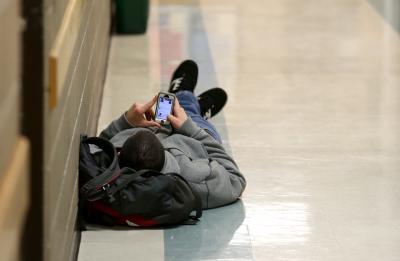 Student looking at phone