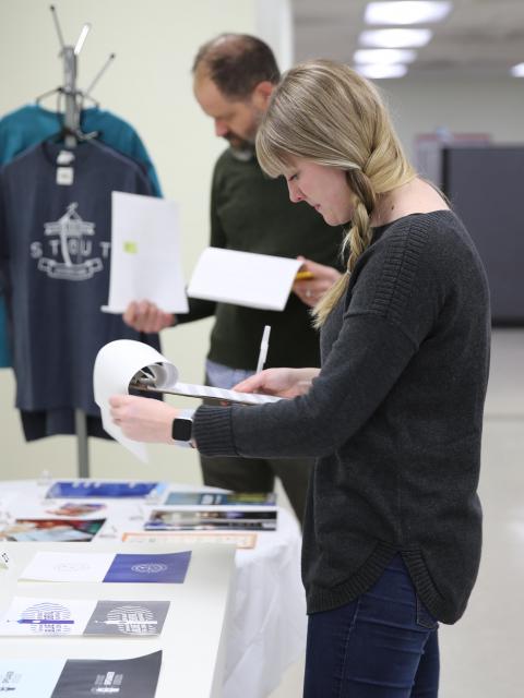 Graphi Design instructor, Katie Lupton, jurying for the SGD Design Show.