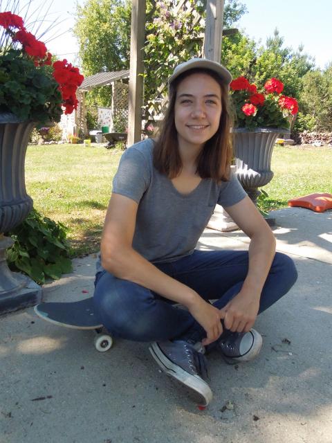 Mary Benetti, game design and development senior, in her garden in Pewaukee.