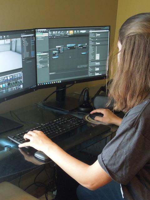Mary Benetti, game design and development senior, at her computer station.