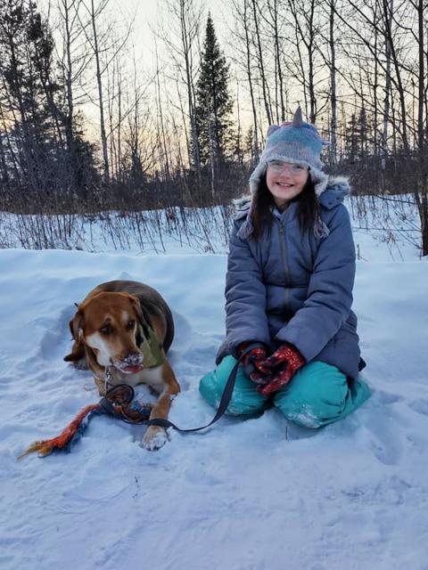 Online psychology students Jessica Bellomy's daughter and their dog.