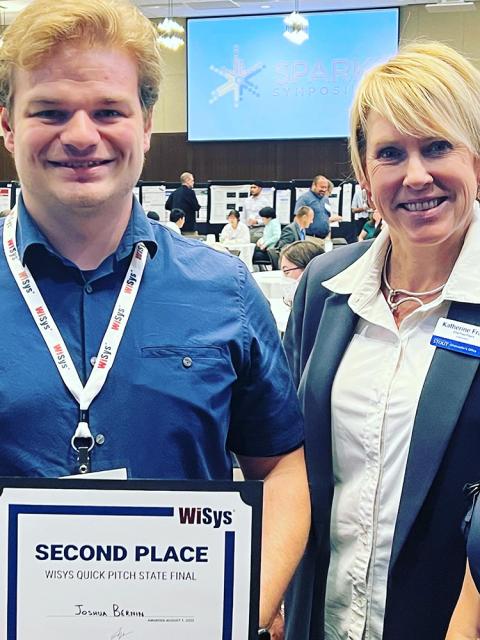 Josh Bernin of UW-Stout, with Chancellor Katherine Frank, took second place in the WiSys Quick Pitch state finals held at UW-La Crosse.