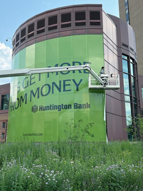 Large sign installed on outside of bank