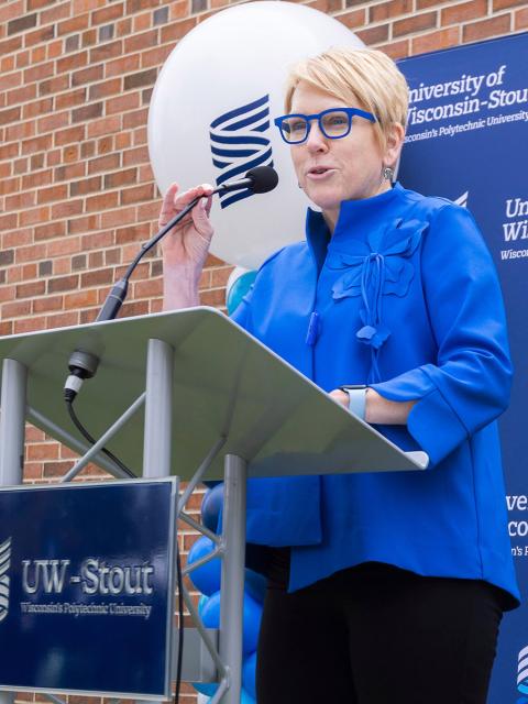 Chancellor speaks at podium